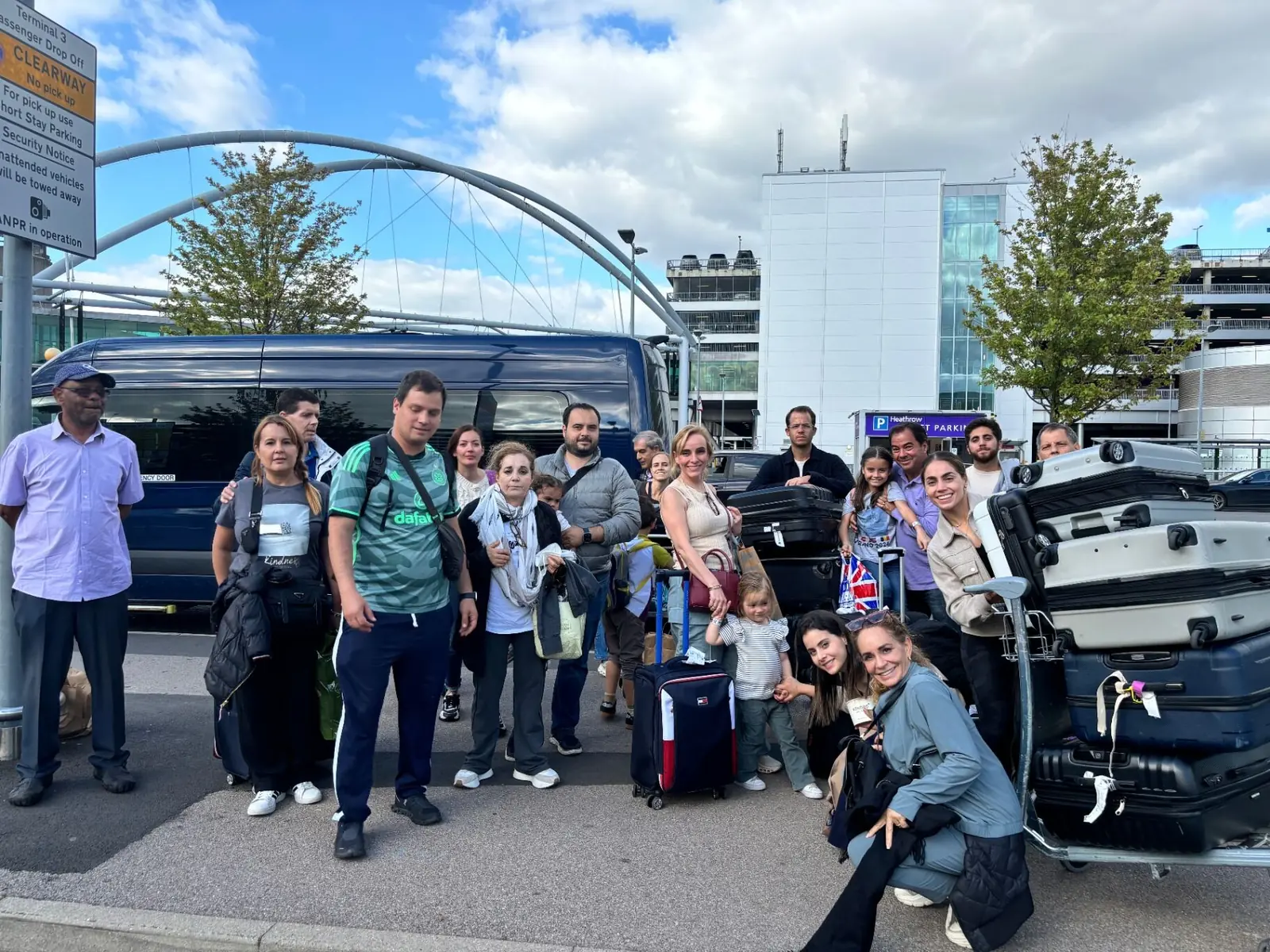 Happy customers with luggage at airport transfer